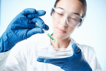 Fototapeta premium Woman in white coat chemical solution biology science technology