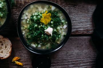 Okroshka in a black plate. Cold soup