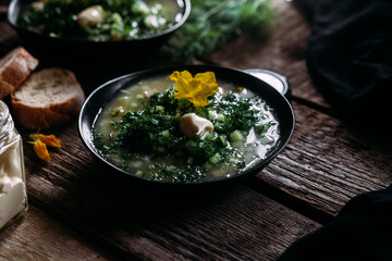 Okroshka in a black plate. Cold soup