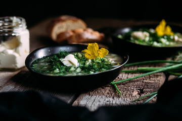 Okroshka in a black plate. Cold soup