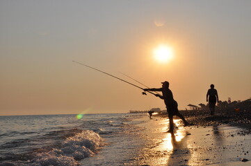 Fototapeta na wymiar Vacation, trip to the sea, sea shore sea fishing 