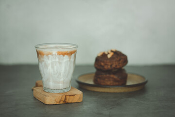 A cup of dirty coffee menu with chocolate scone in the morning