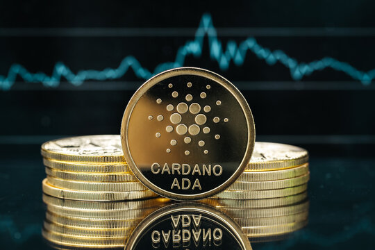 Cardano Ada cryptocurrency coin close-up, in front of a price chart