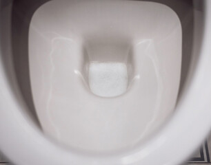 White toilet bowl with detergent