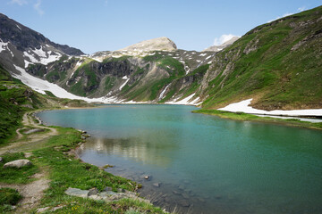 Naklejka na ściany i meble Wonderful alpine lake called Nassfeld Speicher in Hohe Tauern National Park. Austria