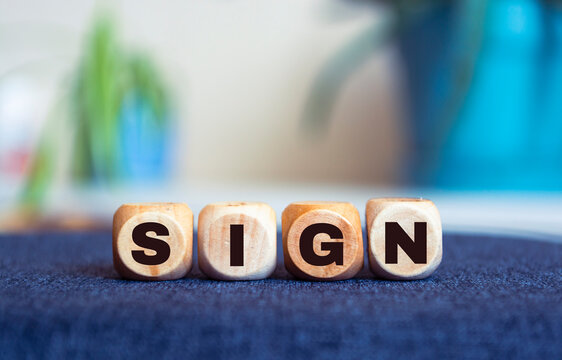 Sign Word Written In Wooden Cubes On an isolated light table. Singing, karaoke or vocal training concept.