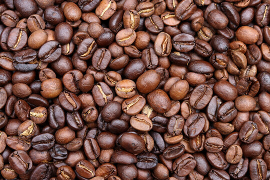 Roasted coffee bean background. 
Beverage concept for wallpaper, backdrop and texture.