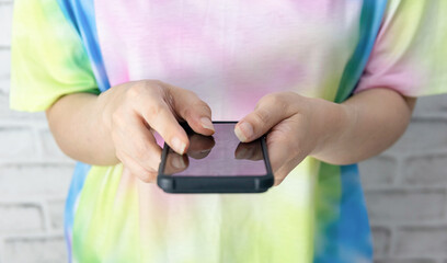woman holding a smartphone with communication technology