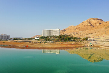 Fototapeta premium Dead Sea hotels on a beautiful morning, Aerial view.