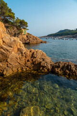 Fototapeta na wymiar Beautiful Tamariu coast on a summer afternoon in the town of Palafrugell. Girona, Costa Brava in the Mediterranean
