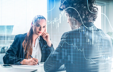 Businessman and businesswoman wearing formal suits are working t