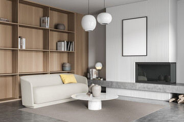 Corner of white and grey living room with sofa and poster