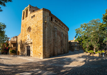 Fototapeta na wymiar Panoramic of the Church of Pals medieval town, streets of the historic center at sunset, Girona on the Costa Brava of Catalonia in the Mediterranean