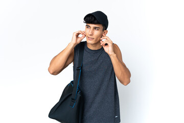 Young sport Argentinian man with sport frustrated and covering ears