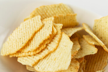 Corrugated chips. Appetizing snack. Close-up.