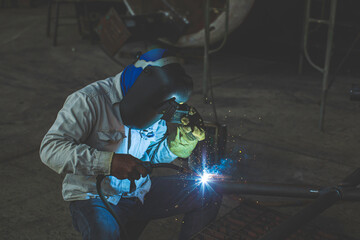 Welding male worker metal is part in machinery nozzle pipeline construction