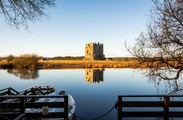The boat crossing at Threave Castle, reflecting on the River Dee in the winter sun