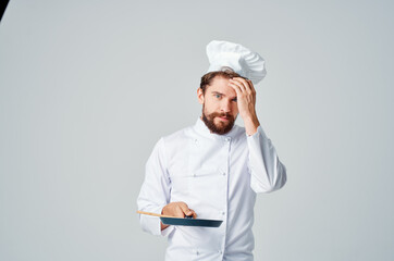 Cheerful male chef cooking food kitchen restaurant work professional