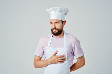 male chef in uniform walkie-talkie professional restaurant light background