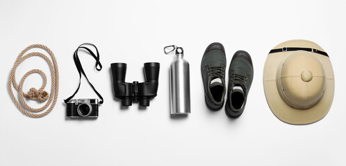 Flat lay composition with different safari accessories on white background © New Africa