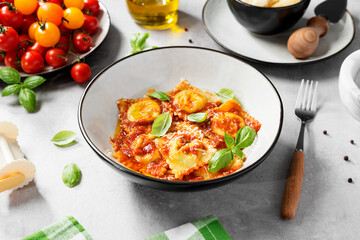 Homemade italian ravioli pasta, stuffed with spinach and ricotta ,served  with tomato sauce,...