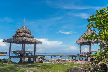 Nature in twilight period which including of sunrise over the sea and the nice beach. Summer beach with blue water and purple sky at the sunset.	
