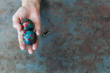 hands of senior adult woman excercising with chinese baoding balls for stress relief and deep...