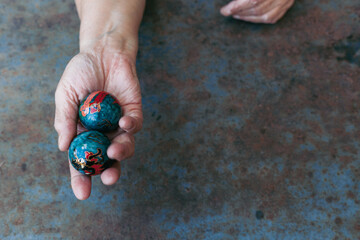 hands of senior adult woman excercising with chinese baoding balls for stress relief and deep...