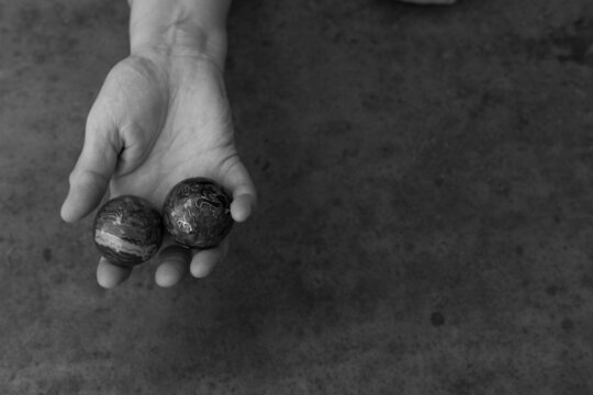 hands of senior adult woman excercising with chinese baoding balls for stress relief and deep relaxation