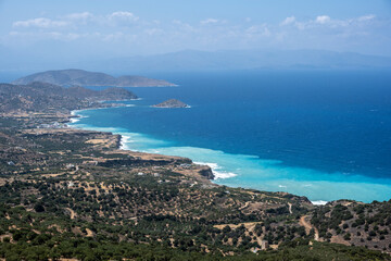 Fototapeta na wymiar panoramic view from the mountain to the coastal seashore with bays and water of different colors 