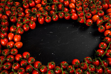 Tomatoes on wood background. Close-up of bio fresh vegetables. Group of summer tomatoes. Space for...