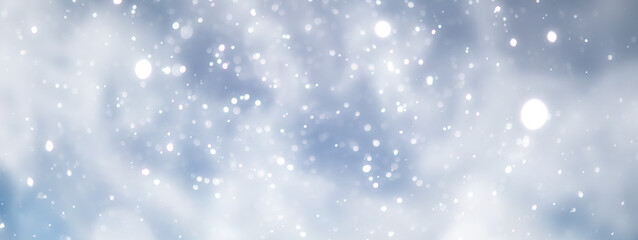 Fototapeta premium blue snowfall bokeh background, abstract snowflake background on blurred abstract blue
