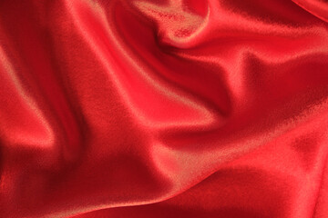 abstract texture of draped red velvet background. eautiful textile backdrop. Close-up. Top view