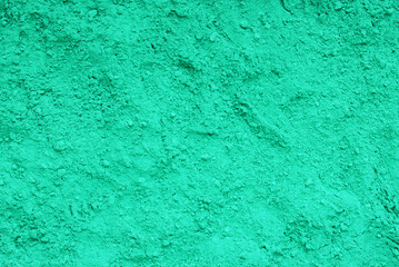Fototapeta na wymiar blue-green sandy background, turquoise textured surface, natural green beach sand, colour powder, creative backdrop