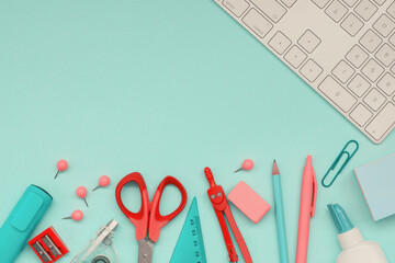 Stationery and office supplies on a color paper background