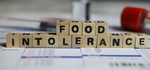 Viersen, Germany - June 1. 2021: Closeup of word on laboratory requisition slip with syringe and vial