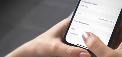 Woman turn off the mobile phone, setting screen close-up, banner design photo