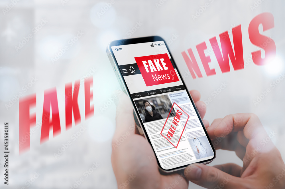 Wall mural Fake News online on smartphone concept, businessman reading Fake news or articles about covid-19 in a smartphone screen application, media technology ,Online fake news on a mobile phone or computers.