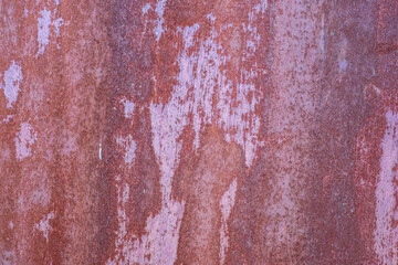 Rust on painted metal when exposed to the environment.