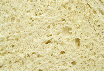 Texture of fresh homemade white bread. Extreme close-up. 