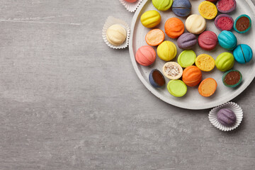 Colorful shortbread cookies on gray concrete background