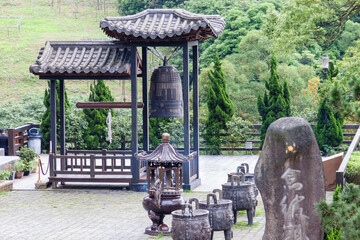 NEW TAIPEI CITY, TAIWAN - JANUARY 27, 2012:  Buddhist ringing bell at Guan Dao Guan Ying Temple