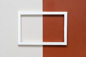 Fototapeta premium white paper frame on dark brown paper and beige paper.