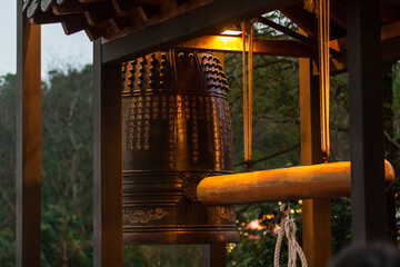 NEW TAIPEI CITY, TAIWAN - JANUARY 27, 2012:  Buddhist ringing bell at Guan Dao Guan Ying Temple