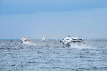 Meteor hydrofoil jet boats and sailboats in Baltic sea bay of St. Petersburg, Russia © ANGHI