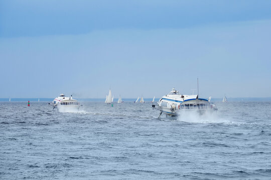 Meteor hydrofoil jet boats and sailboats in Baltic sea bay of St. Petersburg, Russia