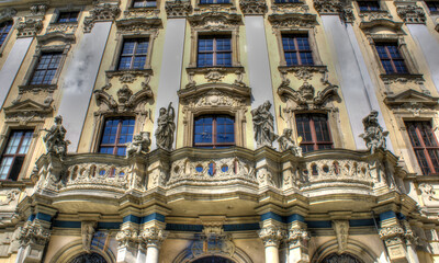 Fototapeta na wymiar Wrocław, Poland, August 2021. Famous Wrocław facades of old historic buildings, tenement houses in the Market Square (Rynek) Europe, Breslau