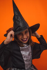 Portrait of a witch laughing with her evil laugh because it is already Halloween