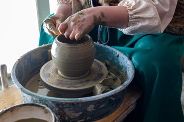 rotating clay jug on a potter's wheel