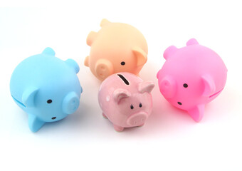 Bankruptcy of savings funds  and quality of investments. Small piggy banks standing and three big piggy banks laying.